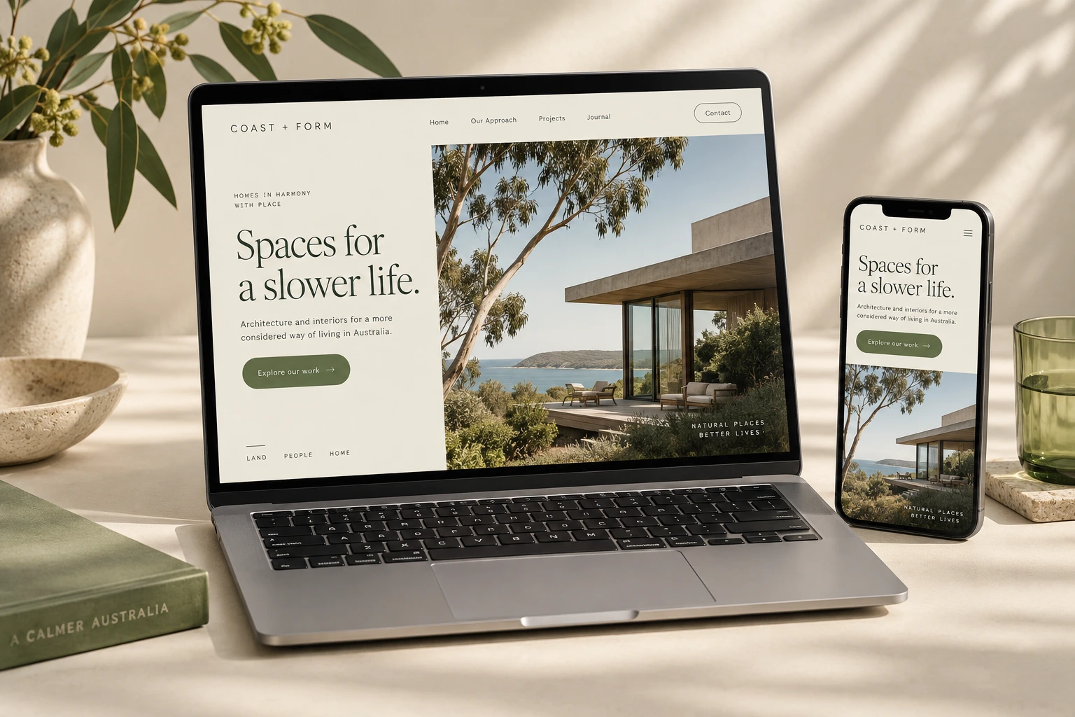 Illustrative architecture website concept shown on a laptop and phone